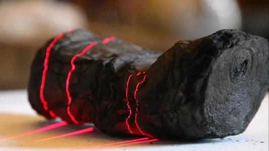 A laser scans a carbonized Herculaneum scroll at the Institut de France. (Image credit: EduceLab)
